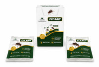 A box of fly bait with two individual sachets placed in front on a plain white background. The packaging is white and dark green with an illustration of a fly and the words 'FLY BAIT' prominently displayed.